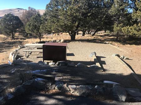 View of Site #10 tent pad, gravel accessibility ramp, bear box, picnic table, and fire ring.Site 10, Pinon Flats Campground