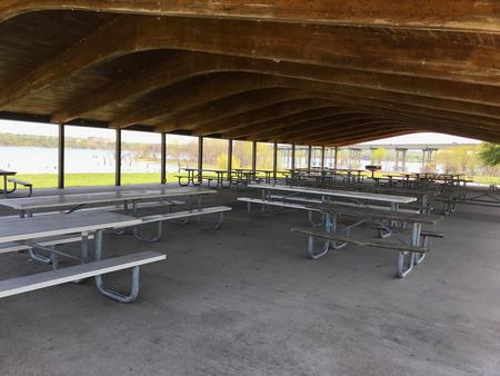 Picnic tables and seating in the Group Shelter pavilion