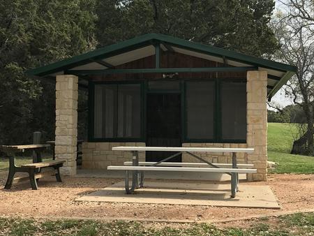 Screen shelter with picnic area, grill, and fire ring 
