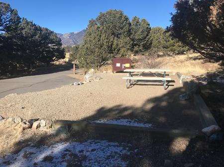 Side view of Site #16 tent pad, picnic table, and bear box, with parking and road on edge of image.Site #16, Pinon Flats Campground