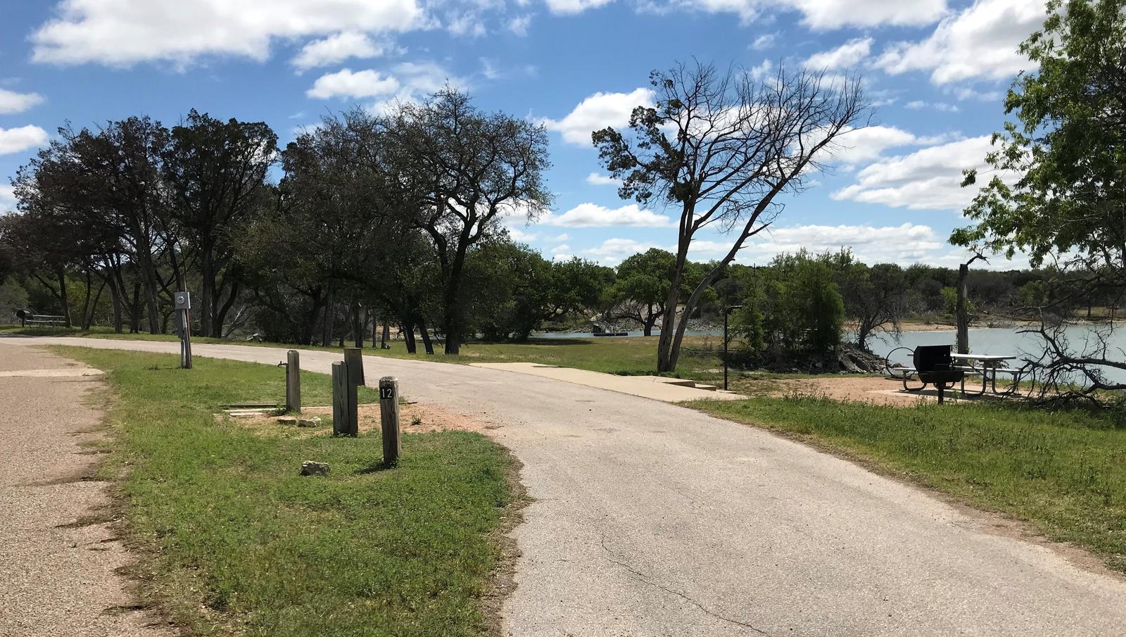 Pull through RV site with picnic table, grill, fire ring, and great view of Waco Lake