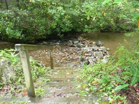Secluded site behind hostCreek and woods.  Has stairs.