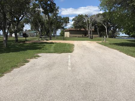 RV site with grill, fire ring, picnic table, and restroom/shower facilites nearby