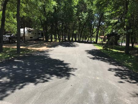 Double RV site with picnic tables, grill, and fire ring