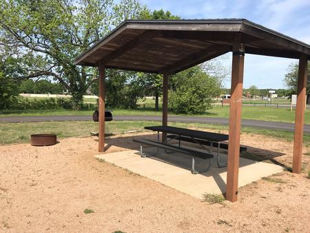Covered picnic table, grill, and fire ring 
