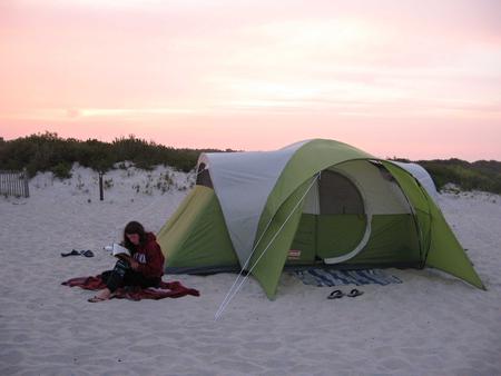 A tent pitched on the sandOceanside campground sites enjoy the sight, smell, and sound of the unceasing wave activity.