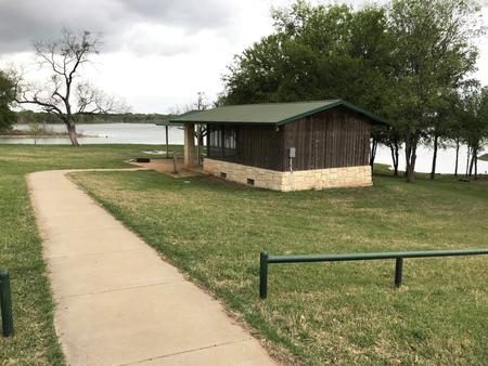 Screen shelter with Waco Lake in the background