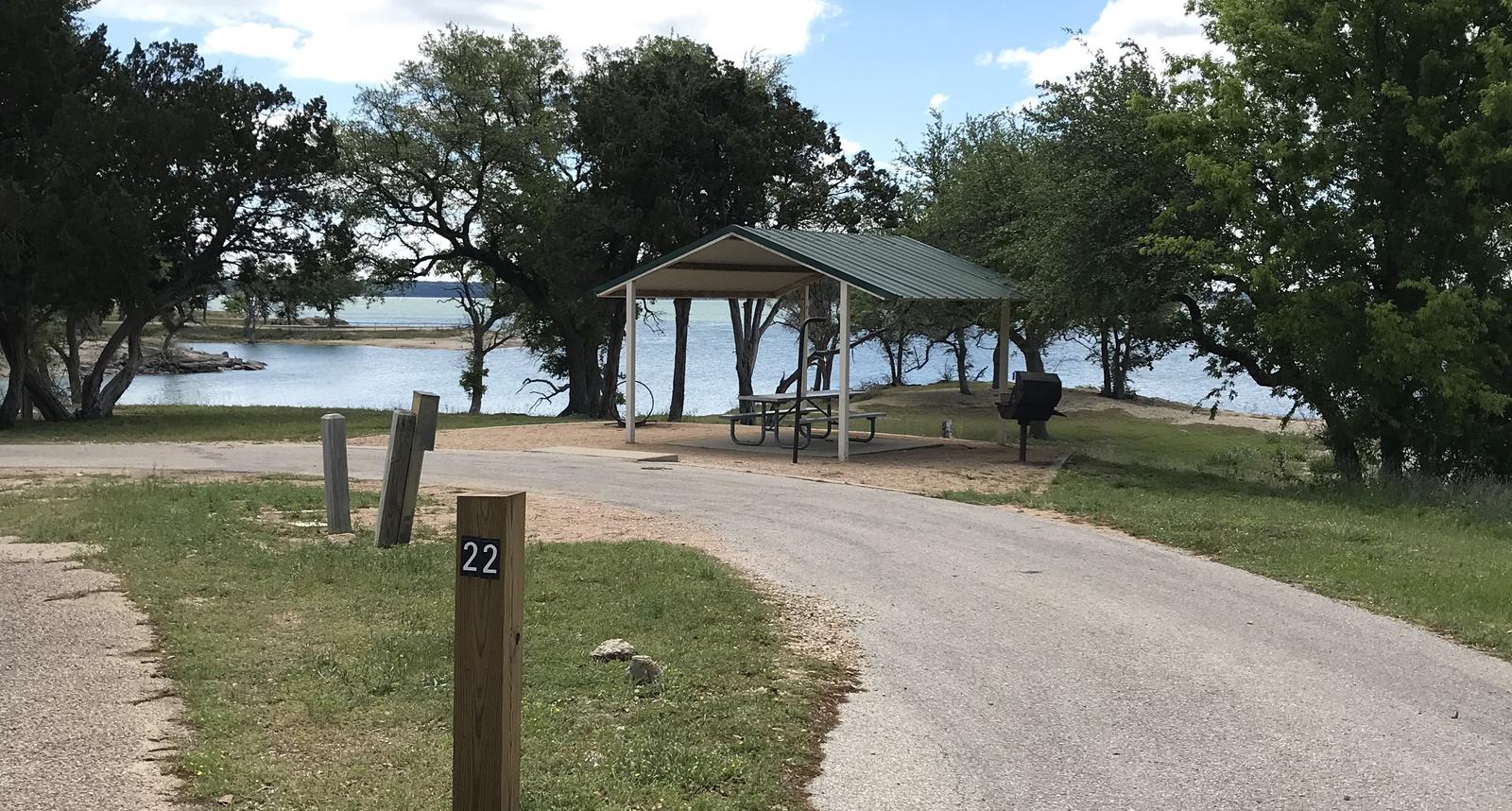 Pull through RV site with grill, fire ring, covered picnic table, and great view of Waco Lake