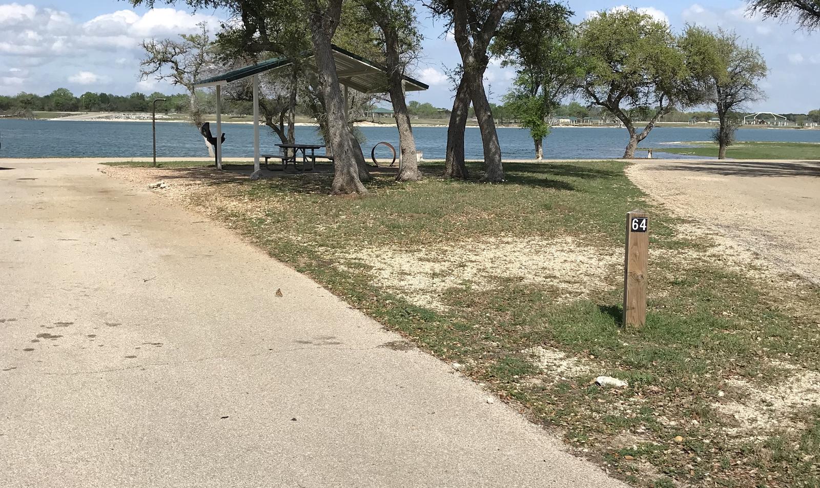 Pull through RV site with grill, fire ring, covered picnic table, and great view of Waco Lake