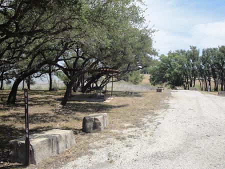 A photo of Site 417 of Loop 4 at FLATROCK (TEXAS) with Picnic Table, Electricity Hookup, Fire Pit, Shade, Water Hookup