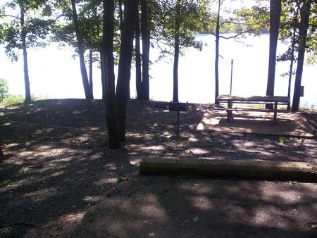 Paved slot, picnic table, water view. Sawnee site 12