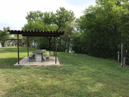 RV site with covered picnic table and grill