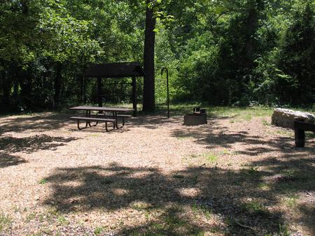 Campsite 6 showing picnic table, lantern post, food shelter and fire ring.Campsite 6 next to Huzzah Creek.