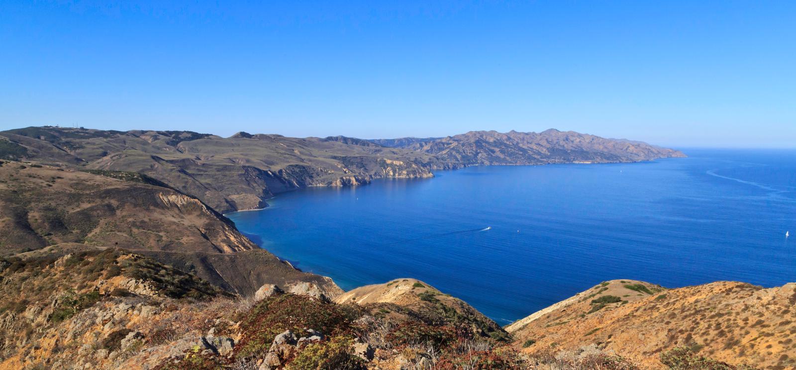 View from a high ridge overlooking the rest of a long, narrow, rugged island with steep cliffs.  Chinese Harbor, Santa Cruz Island
