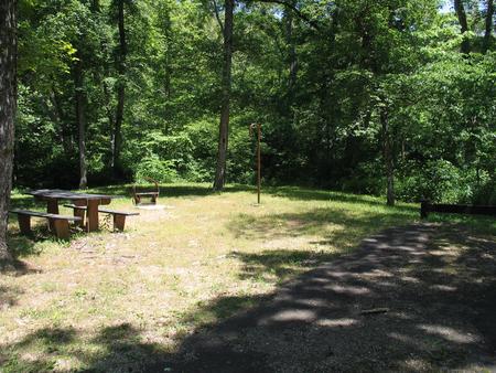 Campsite 16 showing parking spur, picnic table, lantern post and fire ring.Campsite 16