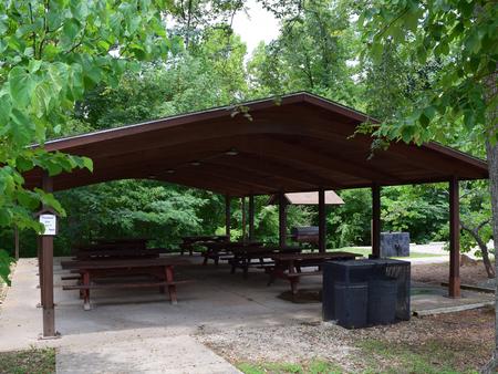 Showing shelter, picnic tables,grill and trash receptacle.Group shelter