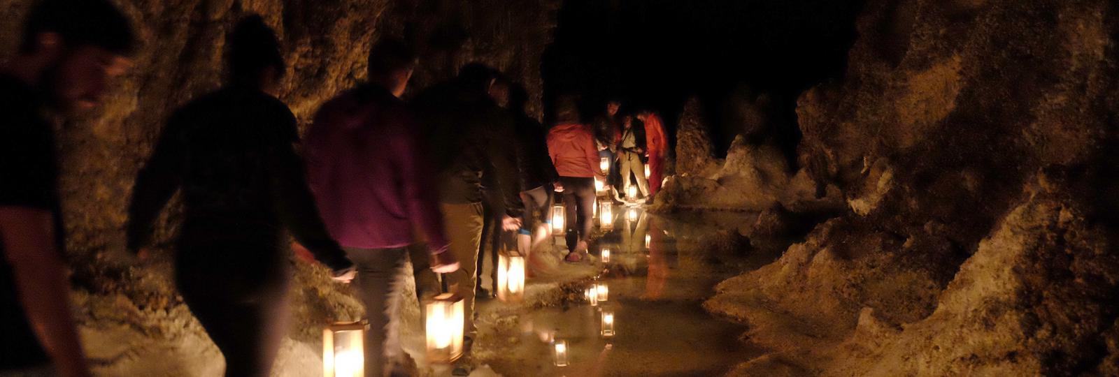 Photo of visitors carrying lanterns on the Left Hand Tunnel Tour.Visitors carrying lanterns on the Left Hand Tunnel Tour.
