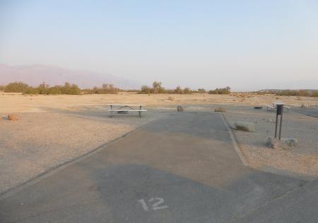 Standard Non-electric Campsite #12 with picnic table, fire ring, and paved parking pad at Furnace Creek Campground. Standard Non-electric Campsite #12 with picnic table, fire ring, and paved parking pad at Furnace Creek Campground.
