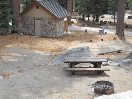 Boulder Basin campsite 3 with picnic table, fire ring, and restroom.