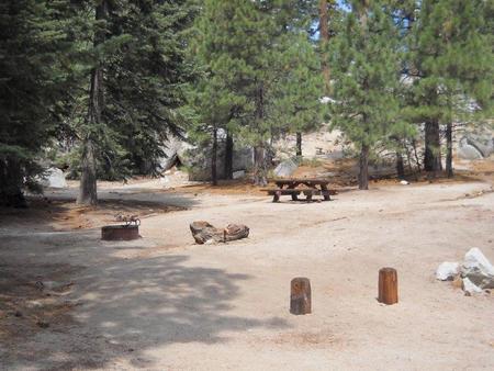 Boulder Basin campsite 5 with picnic table and firepit.