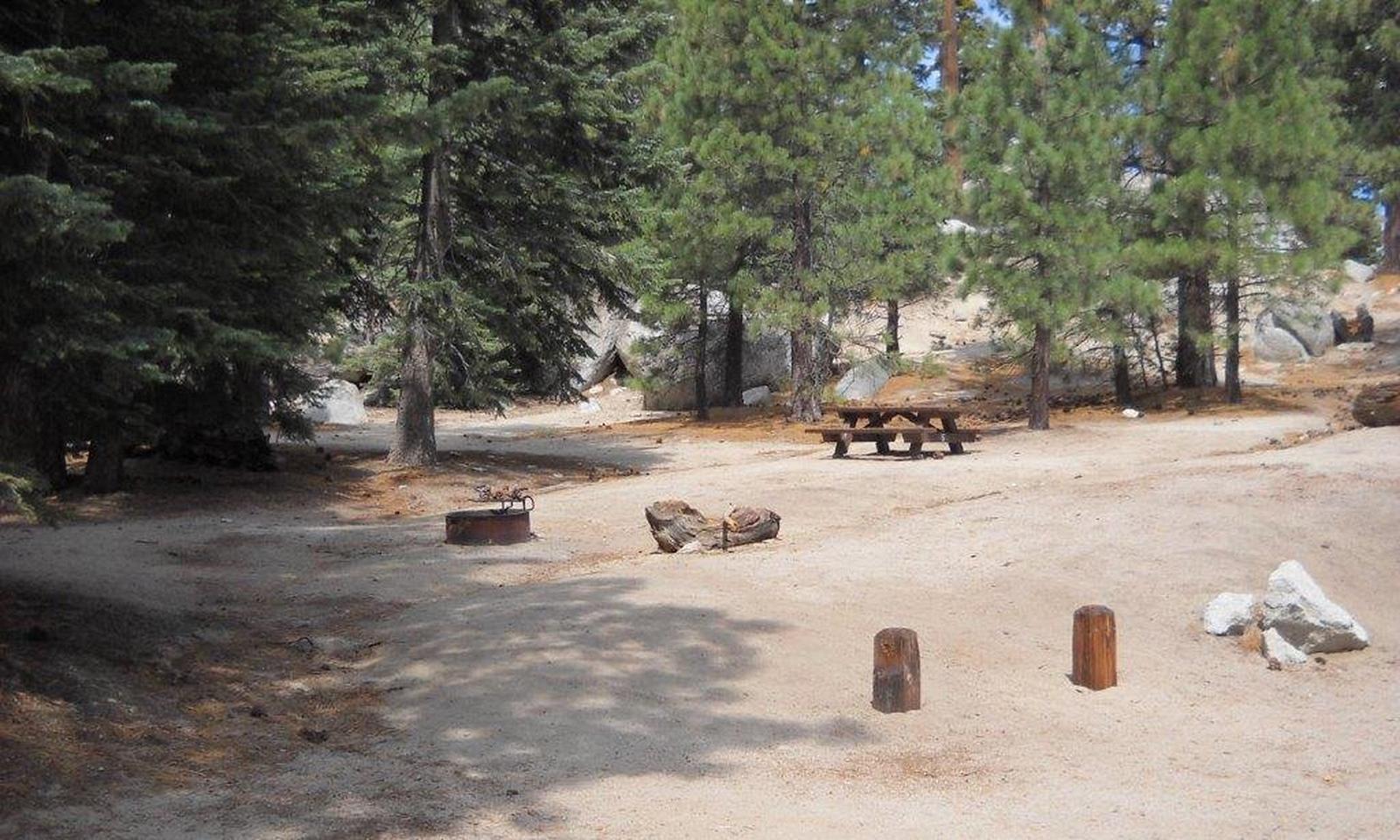 Boulder Basin campsite 5 with picnic table and firepit.