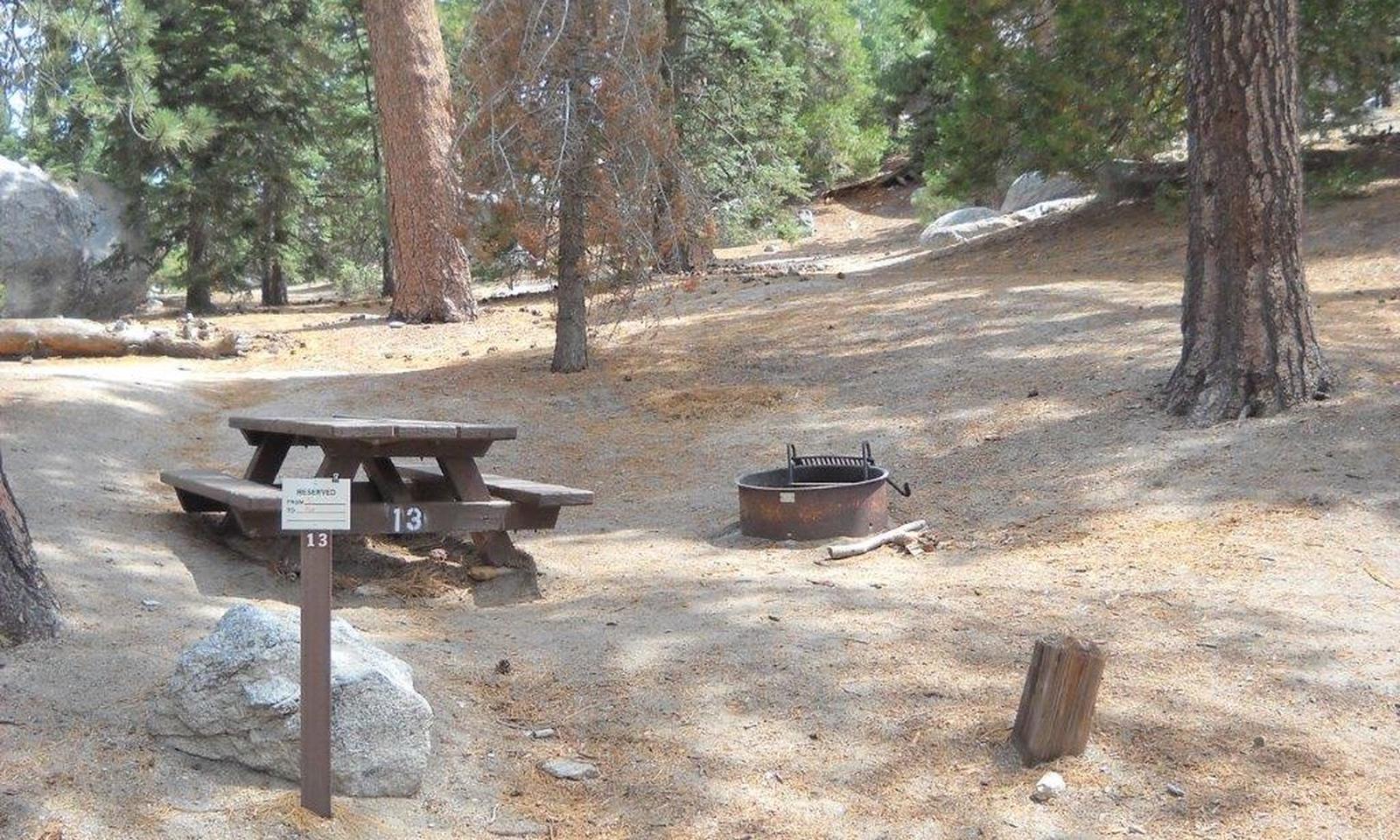 Boulder Basin campsite 13 with picnic table and fire pit.