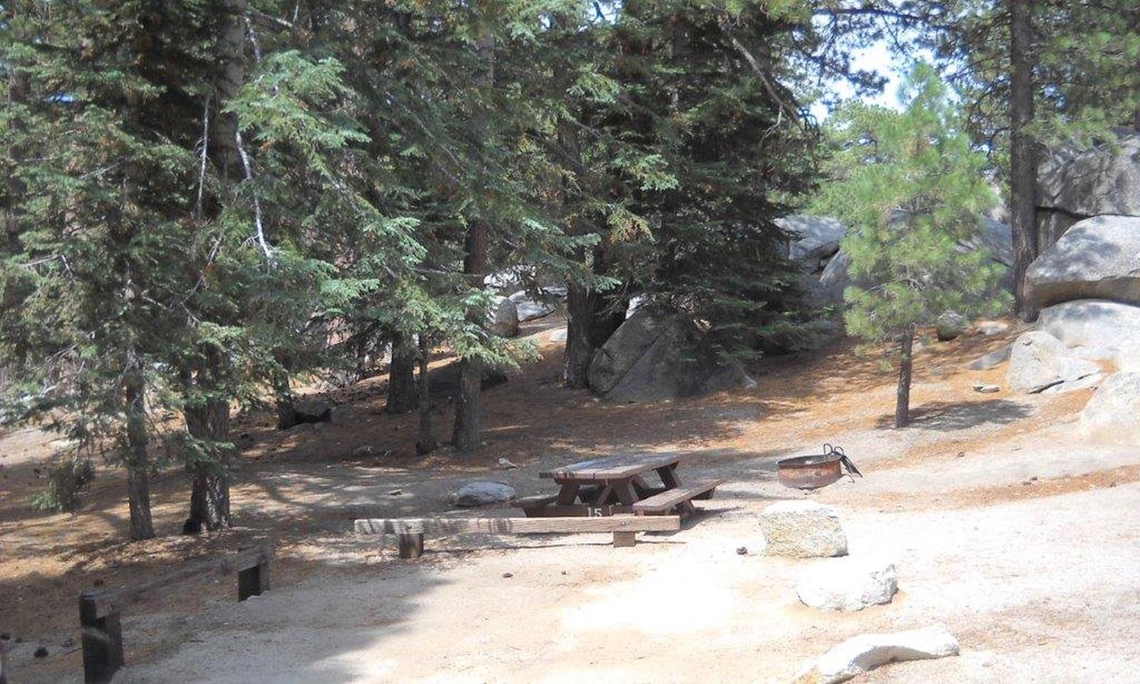 Boulder Basin campsite 15 with picnic table, fire pit and parking area.