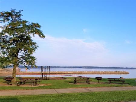 Picnic Area at Spillway Recreation AreaPicnic area and swing set overlooking the lake and spillway.