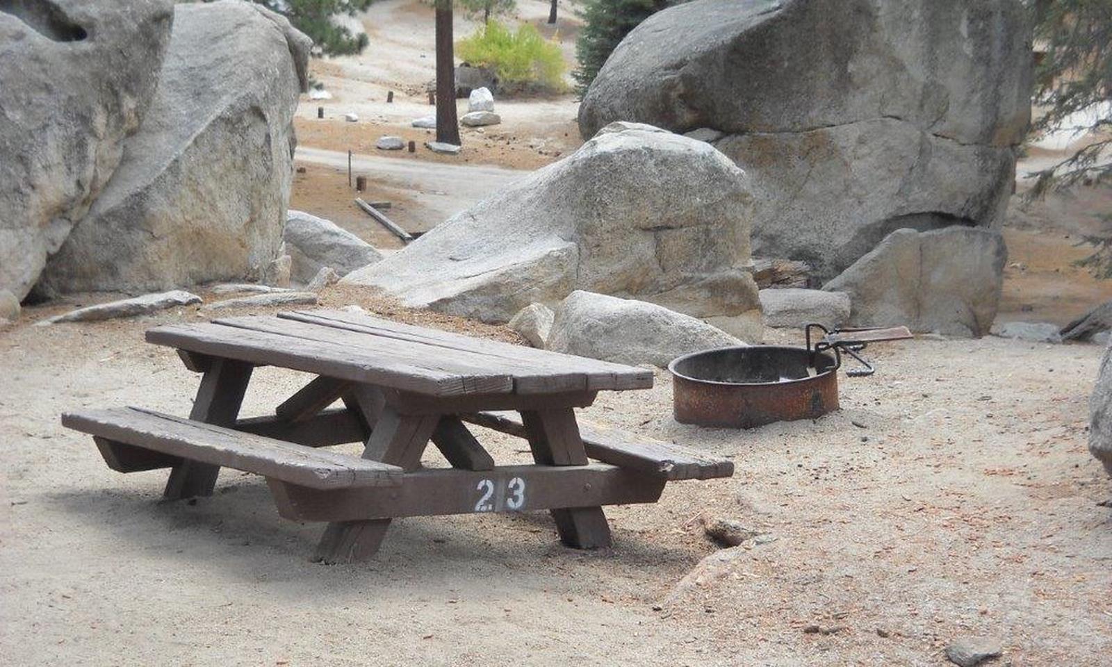 Boulder Basin campsite 23 with picnic table and fire pit.