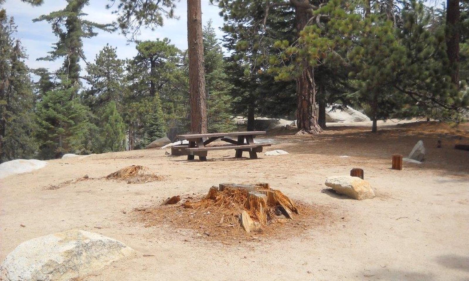 Boulder Basin campsite 27 with picnic table and fire pit.