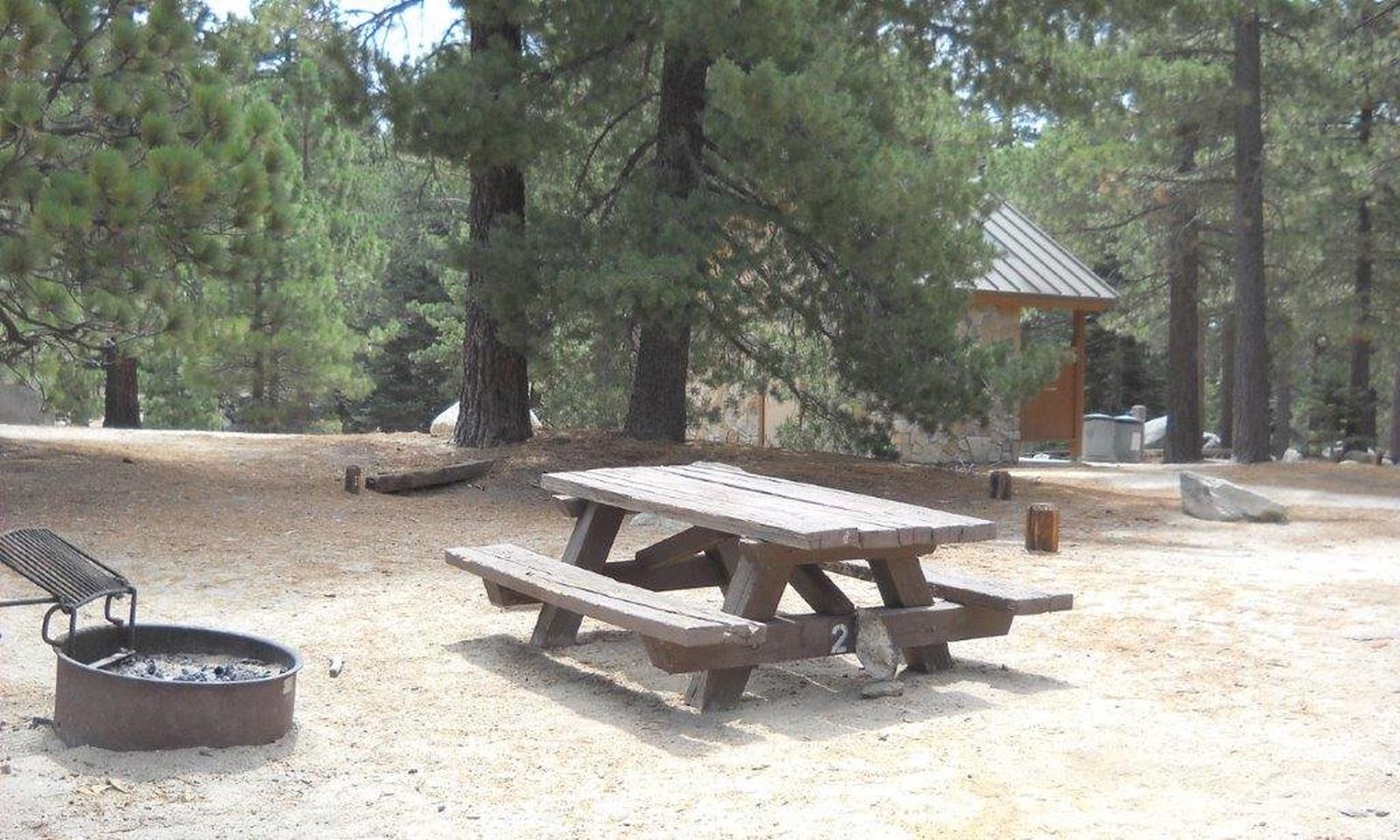 Boulder Basin campsite 27 with picnic table and fire pit.