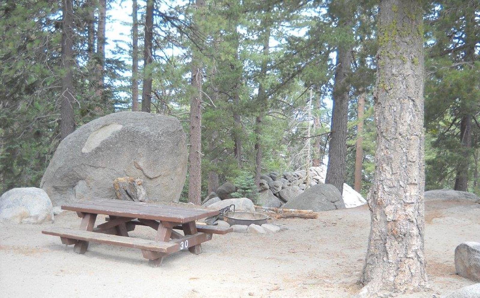 Boulder Basin campsite 30 with picnic table and fire pit.