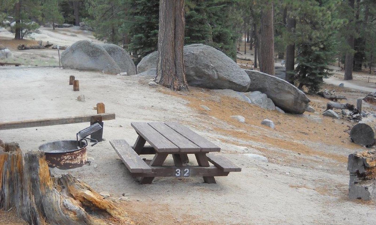Boulder Basin campsite 32 with picnic table and fire pit.