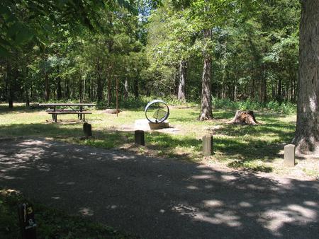 Campsite 13 showing parking spur, picnic table, lantern post and fire ringCampsite 13