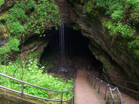 View of the Historic Entrance, the stairs leading into the cave with a small waterfall just off trail of the entrance.Historic Entrance of Mammoth Cave
