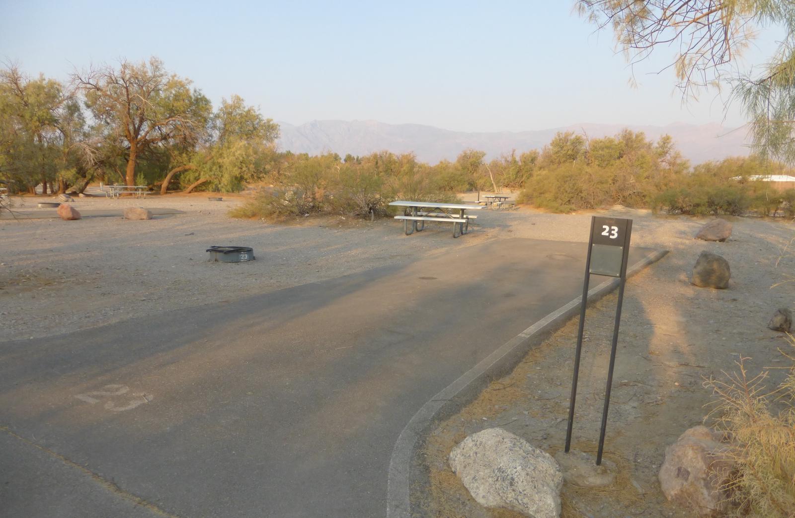 Furnace Creek Campground standard nonelectric site #23 with picnic table and fire ring.
