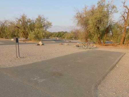 Furnace Creek Campground standard nonelectric site #34 with picnic table and fire ring.