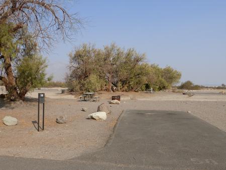 Furnace Creek Campground standard nonelectric site #58 with picnic table and fire ring.