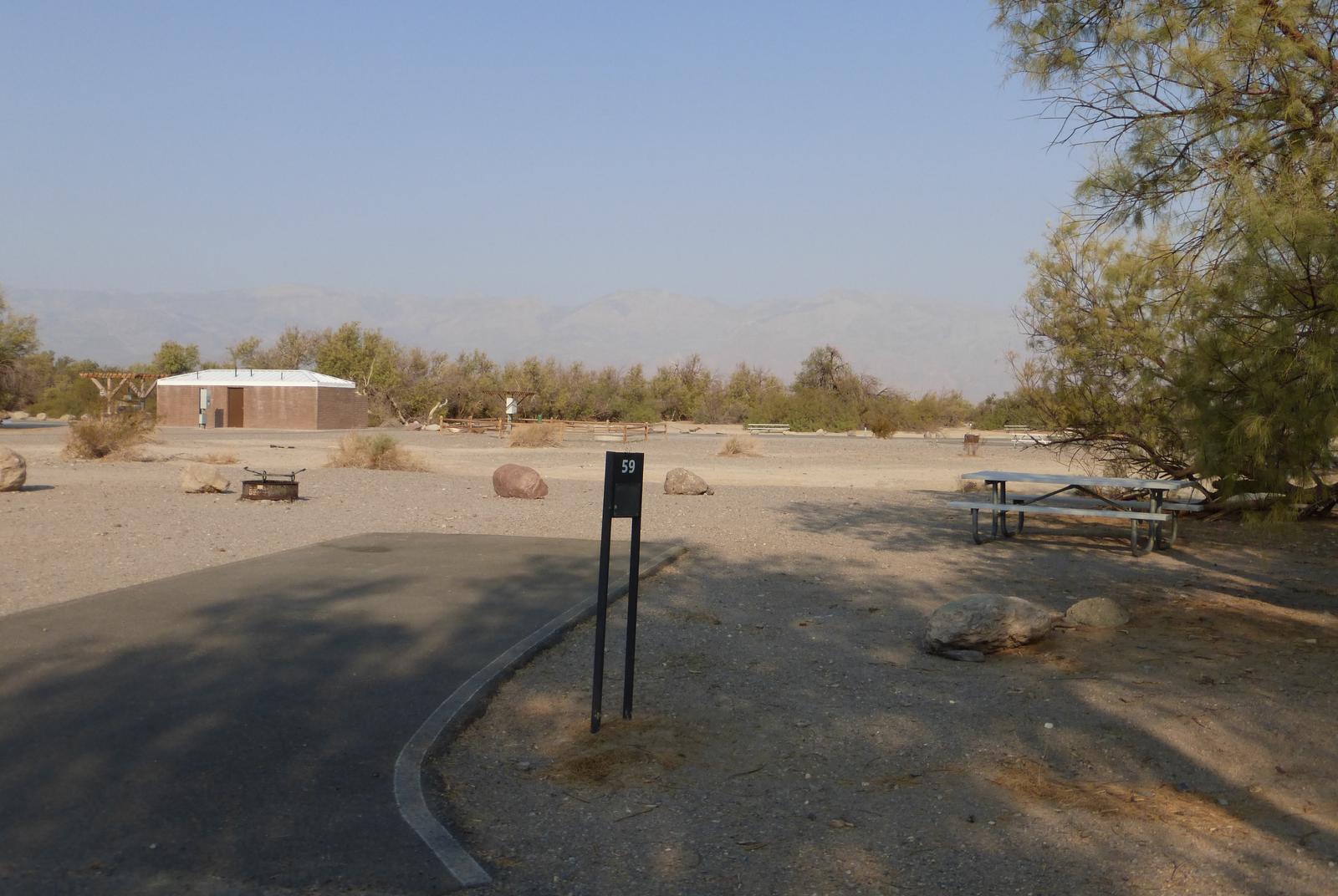 Furnace Creek Campground standard nonelectric site #59 with picnic table and fire ring.