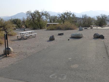 Furnace Creek Campground standard nonelectric site #63 with picnic table and fire ring.