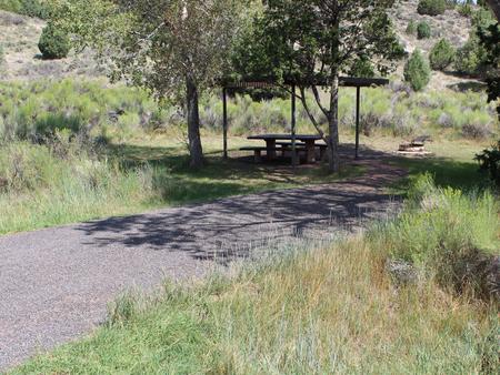 Site 12 with shade structure.Campsite #12 with a shade structure.