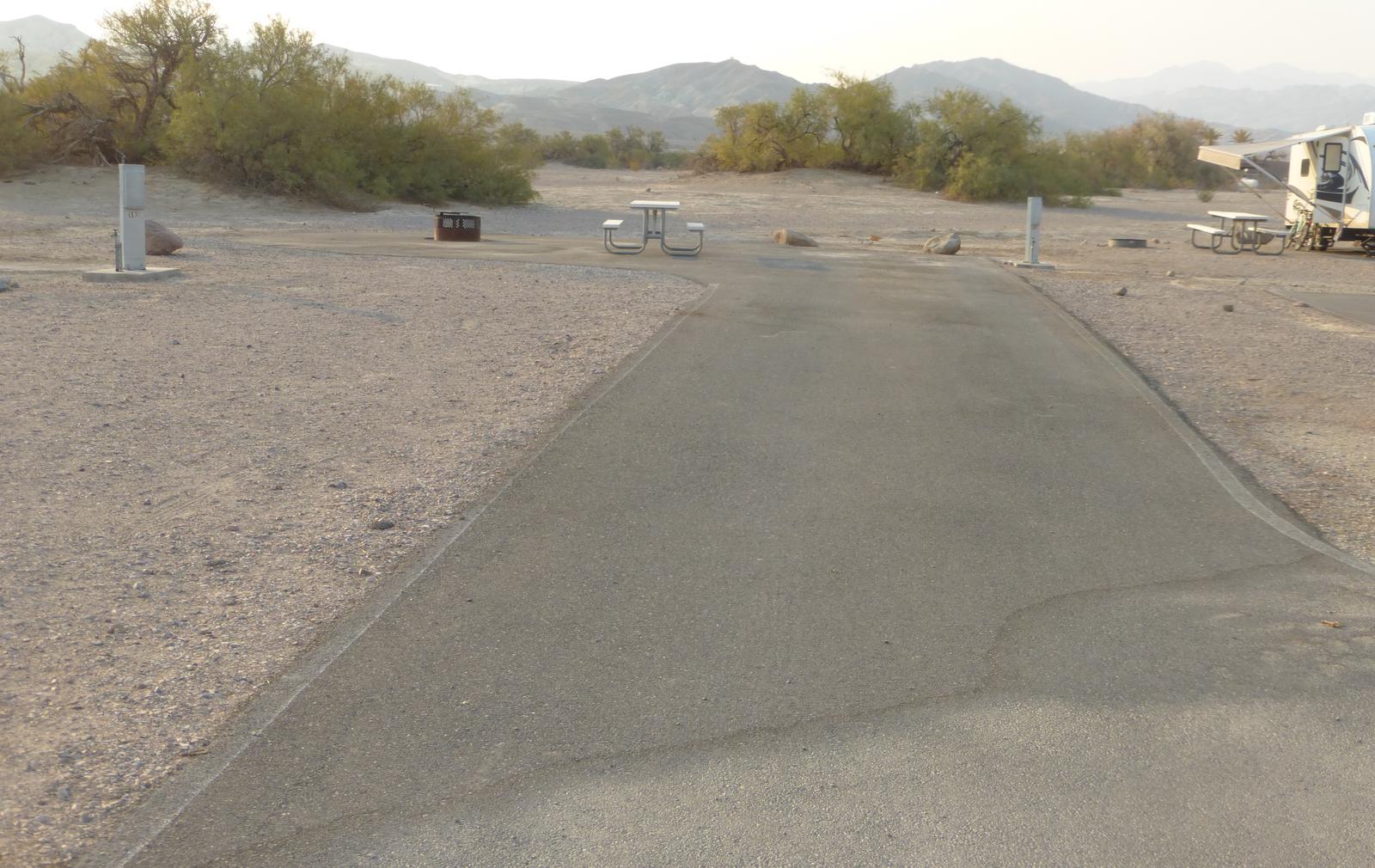 Furnace Creek Campground ADA accessable full hookup site #49. Water, sewer, and 30/50 amp electric connection. One ADA accessible fire pit and picnic table.
