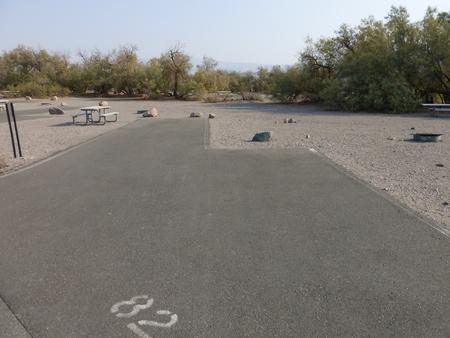 Furnace Creek Campground standard nonelectric site #82 with picnic table and fire ring.