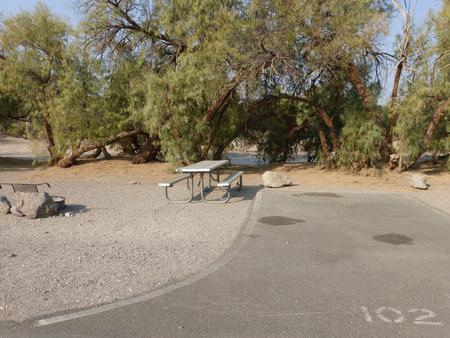 Furnace Creek Campground standard nonelectric tent only drive in site #103 with picnic table and fire ring.