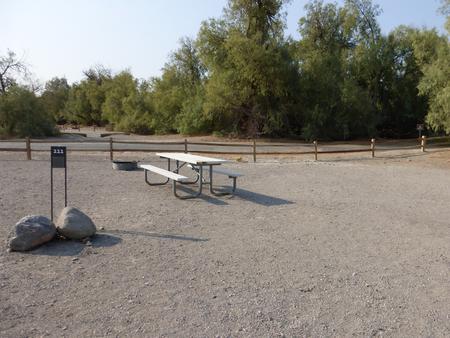 Furnace Creek Campground standard nonelectric site #111 with picnic table and fire ring.