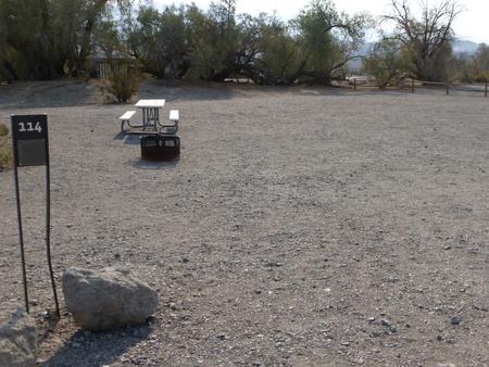 Furnace Creek Campground standard nonelectric site #114 with picnic table and fire ring.