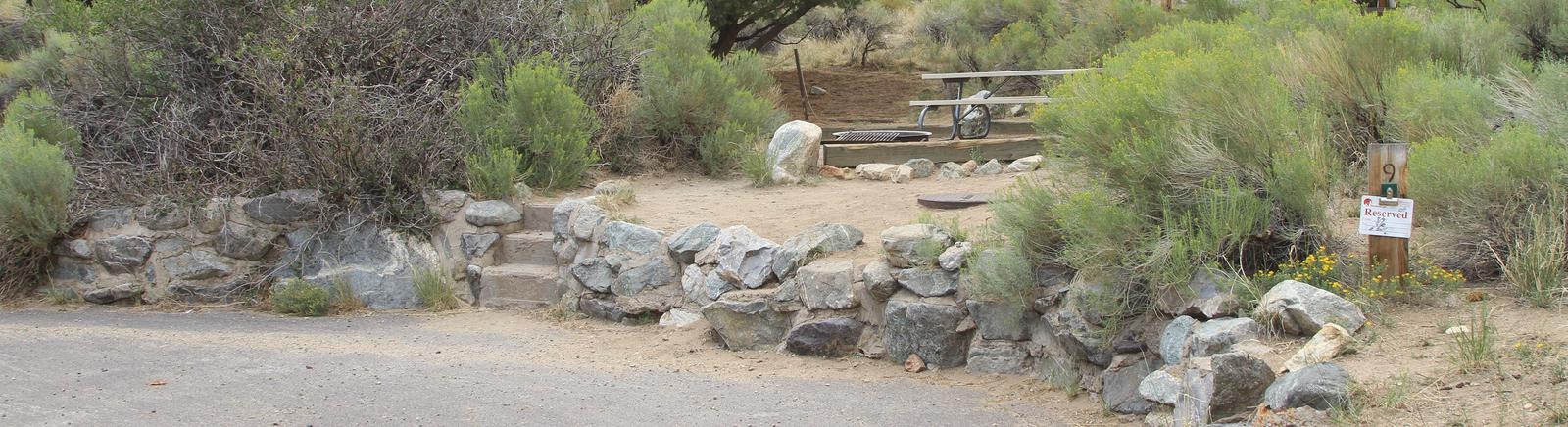 Long view of Site #9 small parallel parking area, stairs, tent pad, and picnic table.Site #9, Pinon Flats Campground