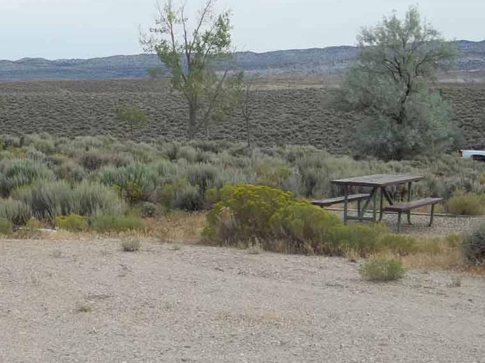 Picnic table that is located on the side a RV parking slot. Antelope Flat Campground: Site 13