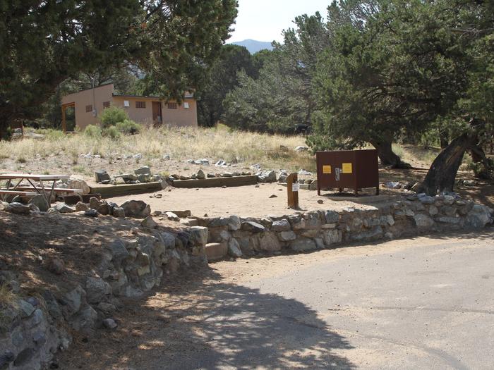 View of Site #24 parallel parking area, stairs, tent pad, fire ring, picnic table and bear box. Site is fully in the sun.Site #24, Pinon Flats Campground