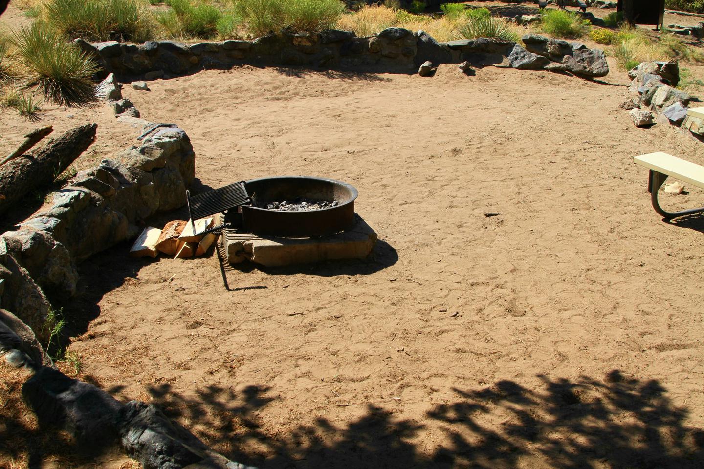 Back view of Site #70 tent pad with fire ring.Site #70, Pinon Flats Campground